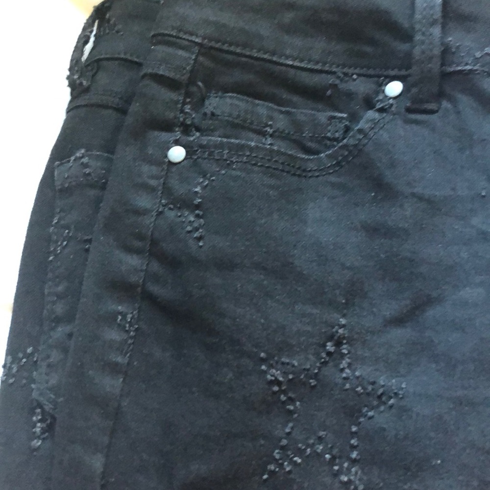 Black jeans with star detail